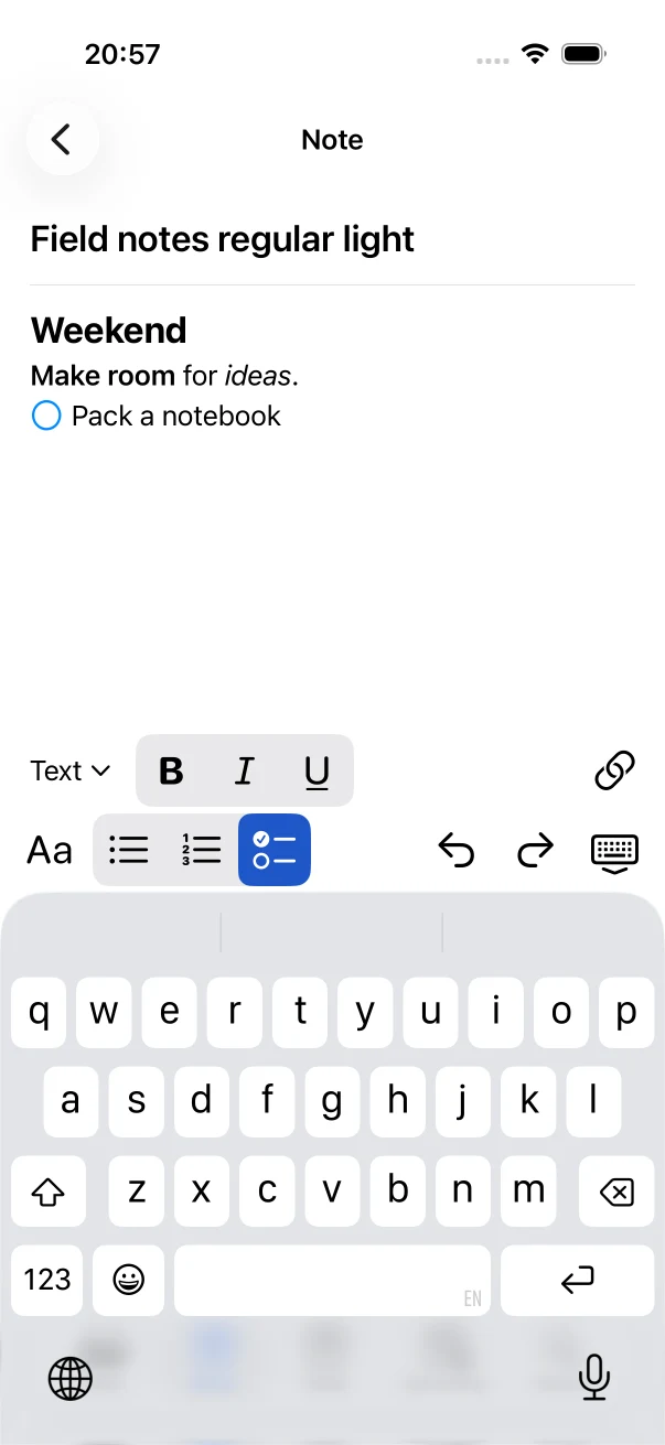 NoteTasker's native iPhone editor showing formatted text, a live checkbox, and the formatting toolbar.